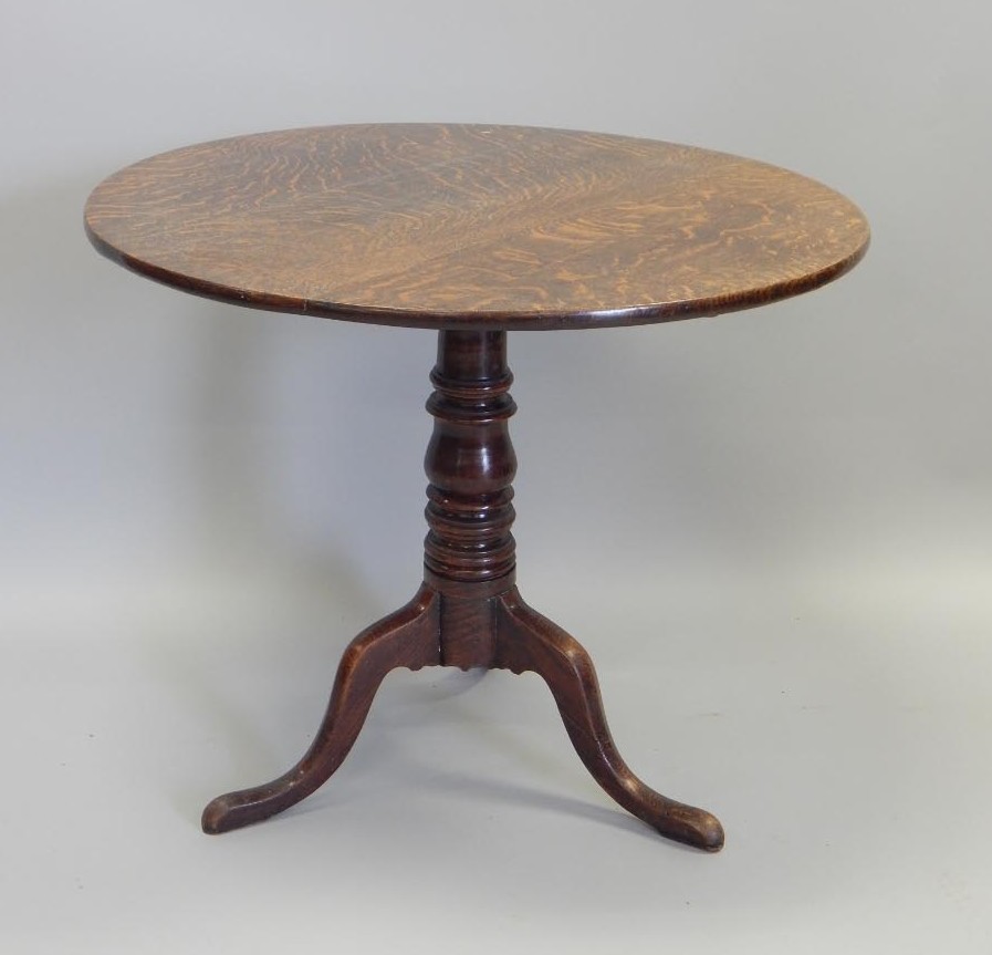 Appraisal: A George III oak occasional table the circular tilt top