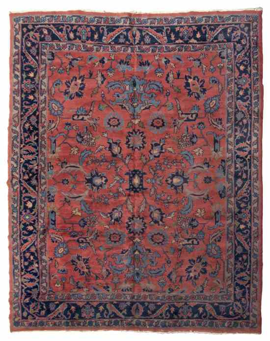 Appraisal: A Sarouk Wool Rug having allover foliate decoration on a