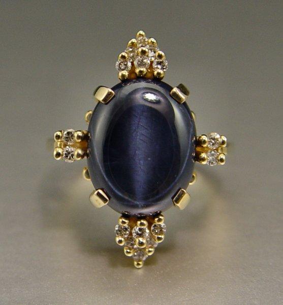 Appraisal: K STAR SAPPHIRE DIAMOND RING K yellow gold ring contains