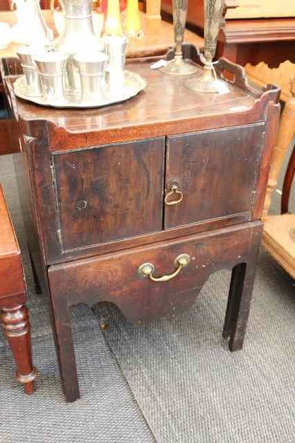 Appraisal: A GEORGIAN MAHOGANY BEDSIDE COMMODE with galleried top above two