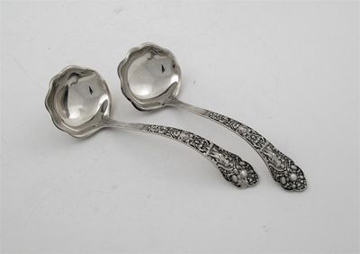 Appraisal: A pair of late th century American decorative sauce ladles