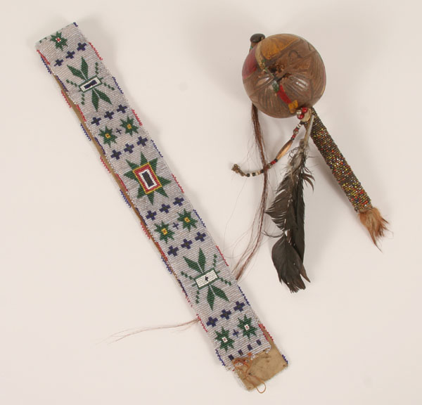 Appraisal: Native American wooden beaded rattle and belt Rattle L