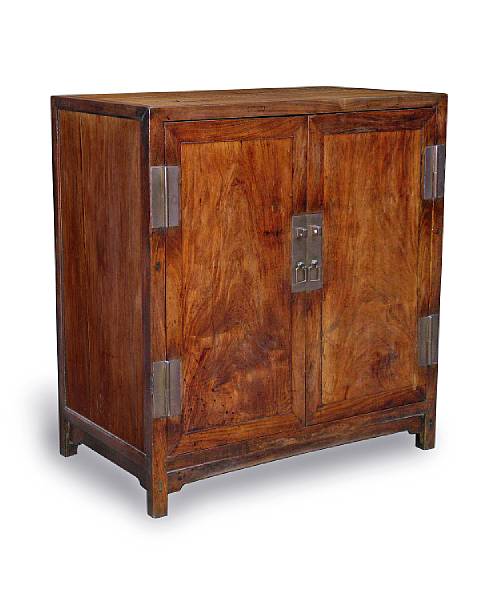 Appraisal: A Chinese huanghuali two-door cabinet th century Of rectangular form