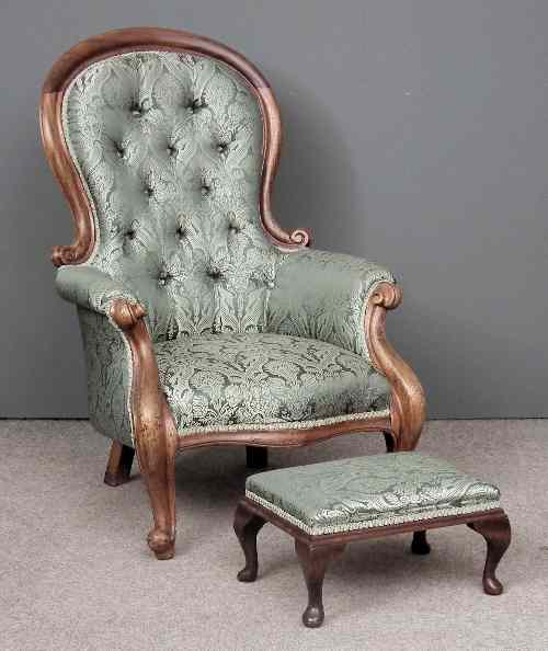 Appraisal: A Victorian stained wood framed spoon back easy chair with