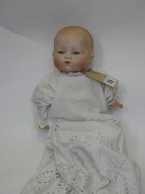 Appraisal: An Armand Marseille bisque head baby doll with blue glass