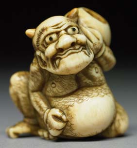 Appraisal: ANTIQUE IVORY NETSUKE Antique carved ivory netsuke of an oni