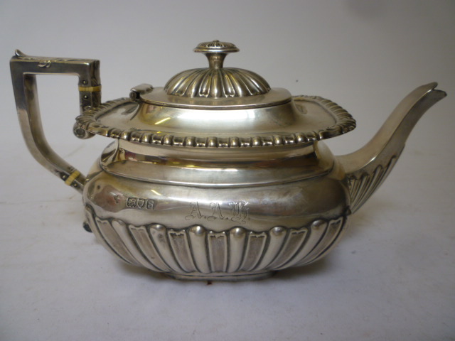 Appraisal: A GEORGIAN STYLE TEAPOT maker's mark indistinct London of semi