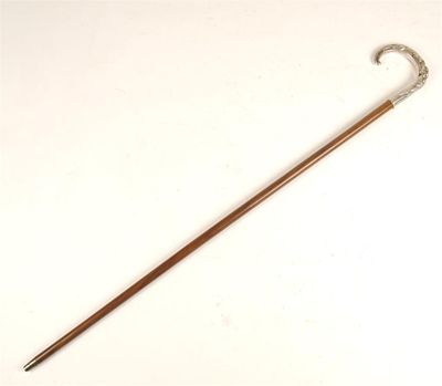 Appraisal: A silver handled cane with a hardwood shaft and a