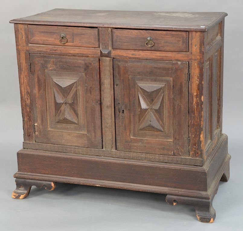 Appraisal: Italian walnut cabinet with two drawers over two doors on