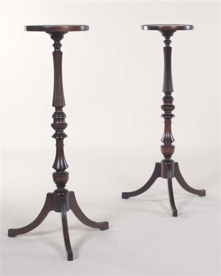 Appraisal: A pair of Regency style mahogany torcheres each with a