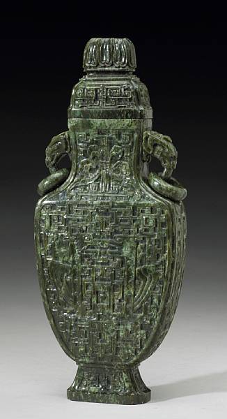 Appraisal: A 'spinach' jade covered vase with loose rings and handles