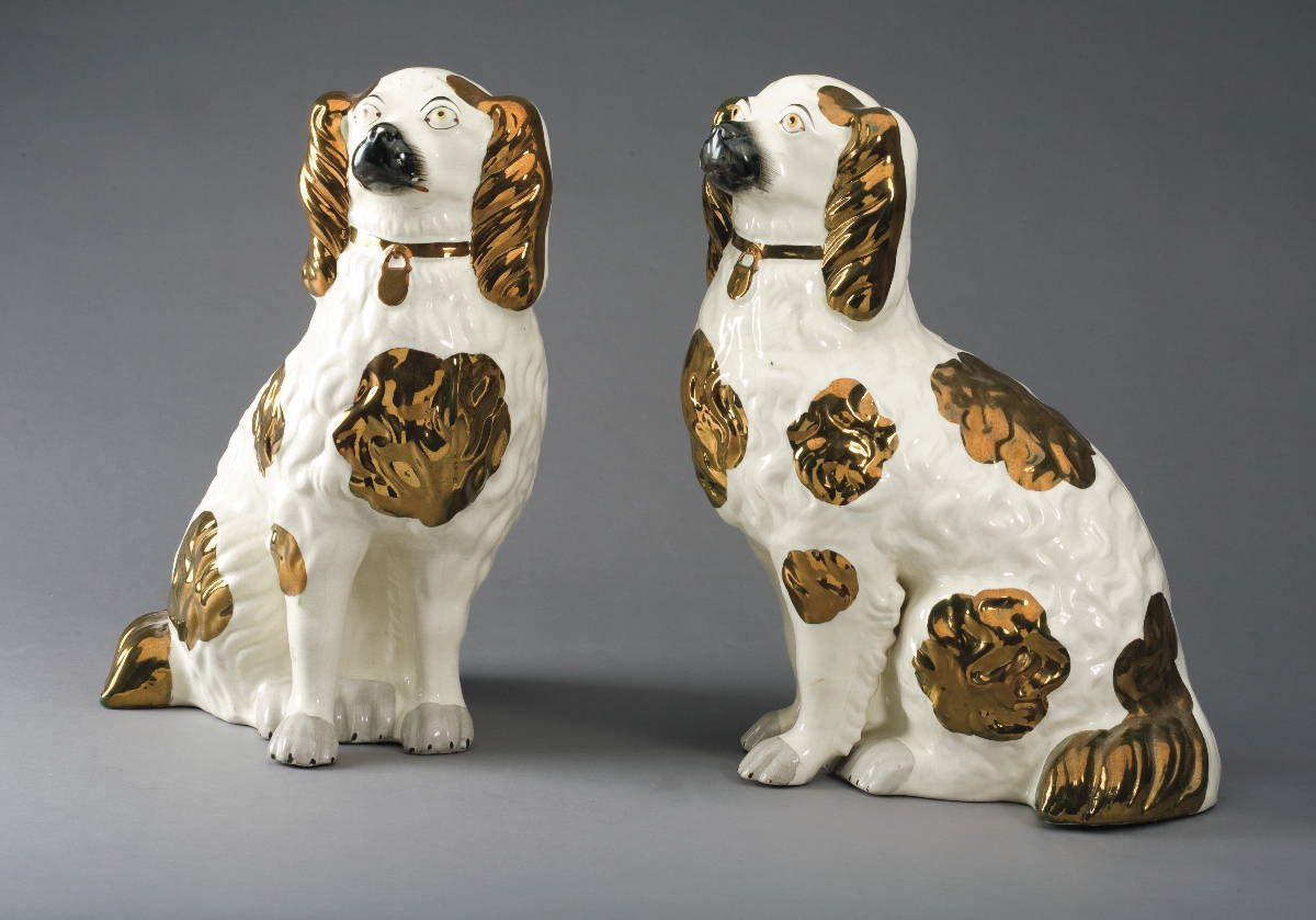 Appraisal: PAIR OF STAFFORDSHIRE COPPER LUSTRE AND ENAMEL-DECORATED FIGURES OF SPANIELS