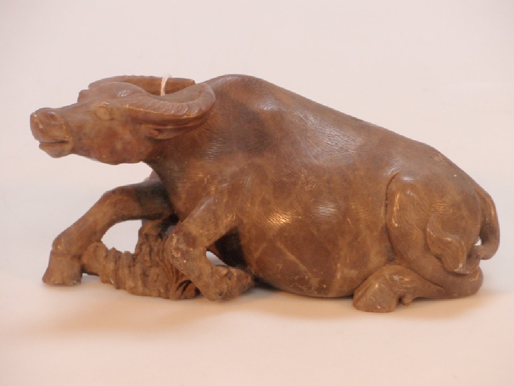 Appraisal: A thC Chinese carved soapstone figure of a water buffalo