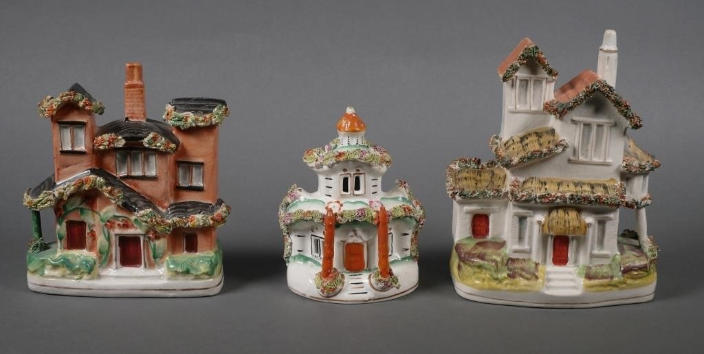 Appraisal: Three Staffordshire soft paste art pottery house figurines All hand