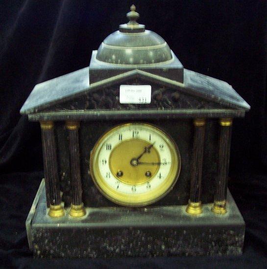 Appraisal: A black marble mantel clock in an architectural case fitted