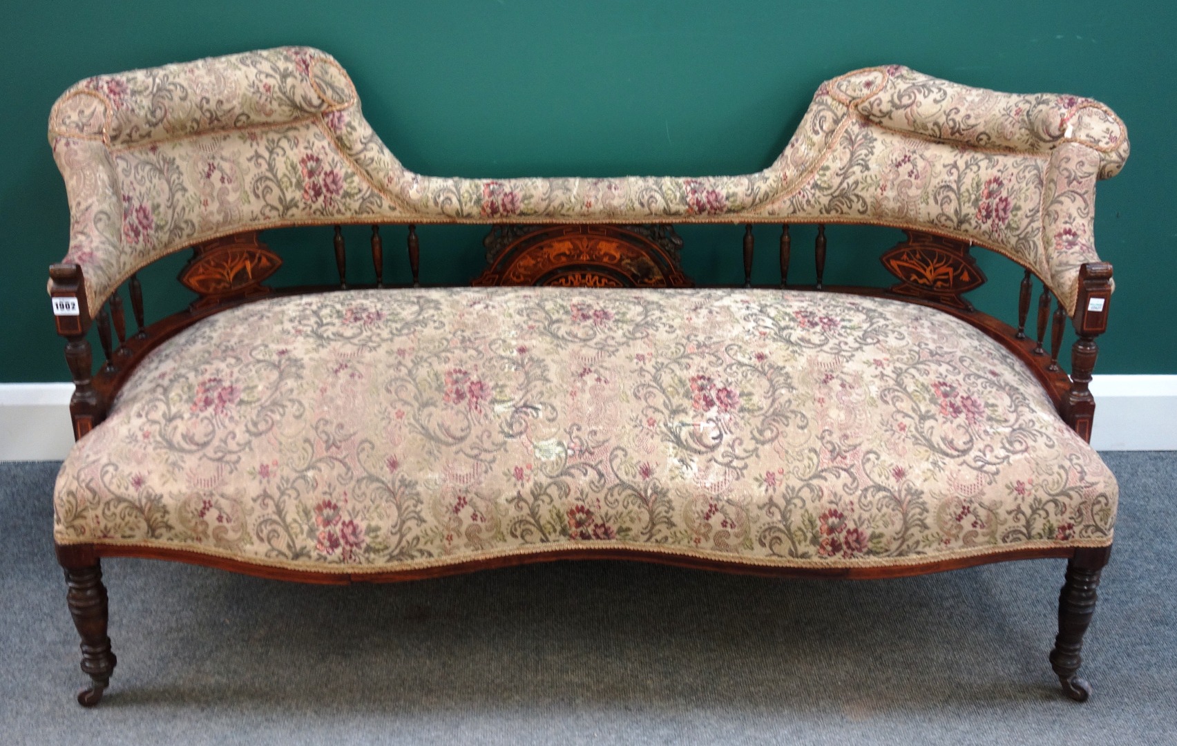 Appraisal: A late Victorian marquetry inlaid rosewood double tub back sofa