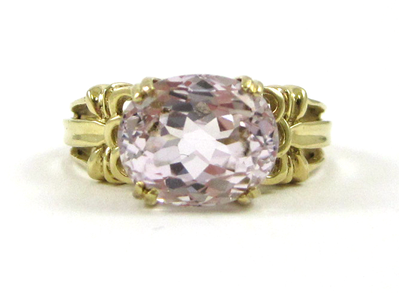 Appraisal: KUNZITE AND FOURTEEN KARAT GOLD RING set with a single