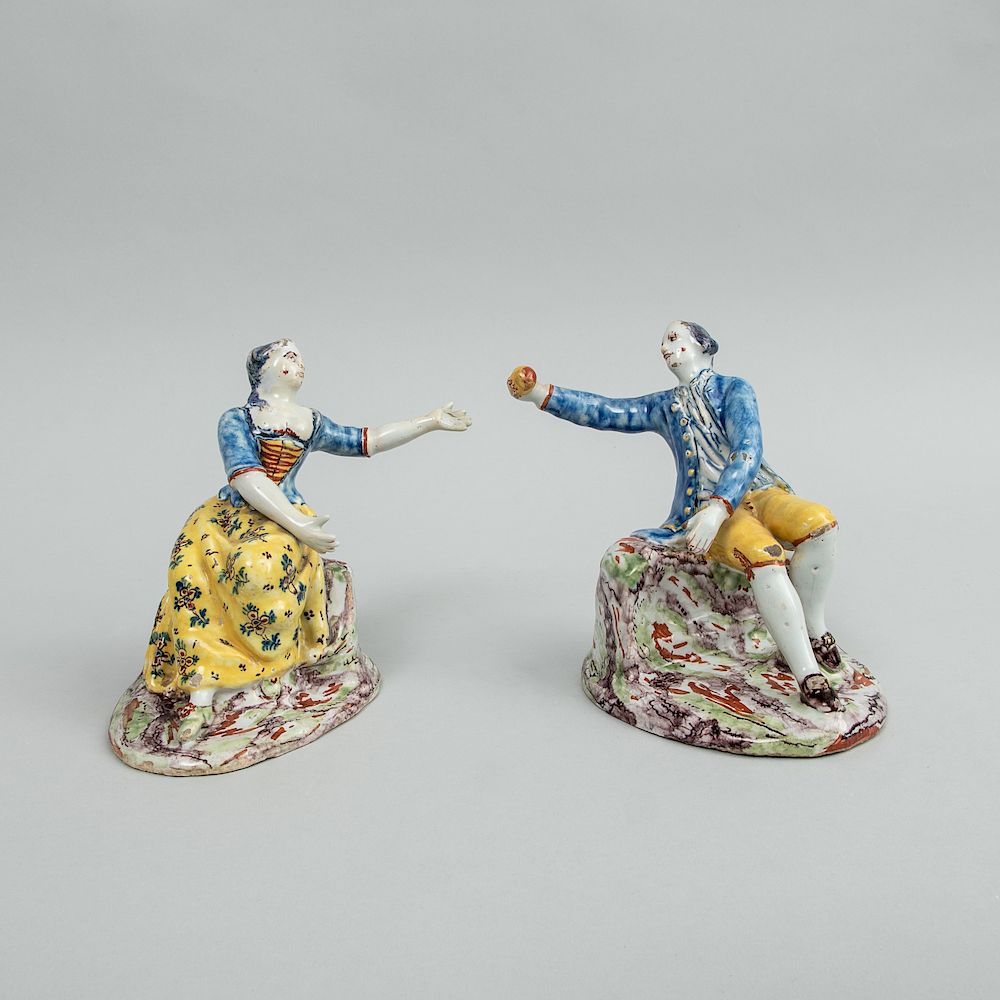 Appraisal: Pair of Dutch Polychrome Delft Figures of a Seated Gallant