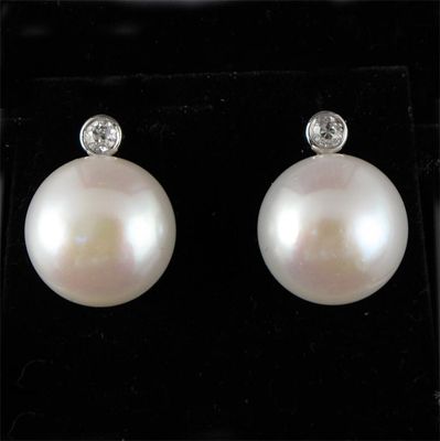 Appraisal: A pair of cultured pearl and diamond drop earrings The