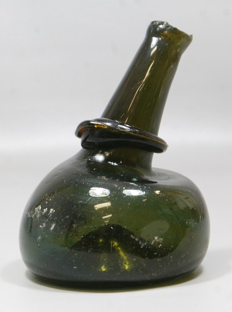 Appraisal: Deep olive green hand blown bottle bent neck applied coil