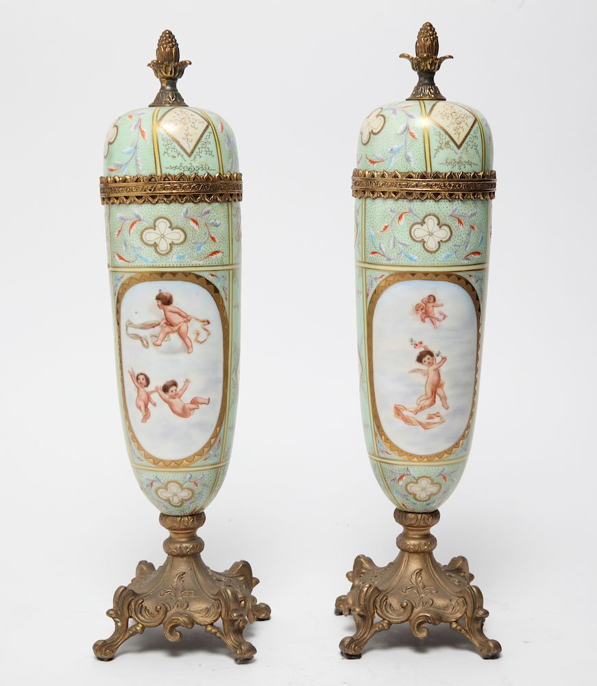 Appraisal: Continental Porcelain Gilt Metal Urns Pair Pair of Continental hand-painted