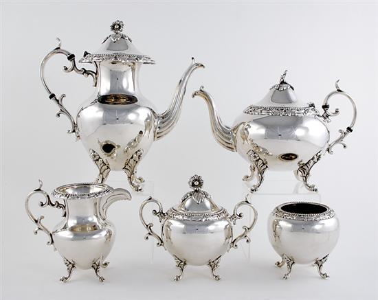 Appraisal: English silverplate tea and coffee service floral finial on domed