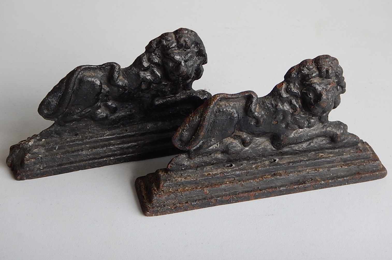 Appraisal: Two thC cast iron flatback recumbent lions