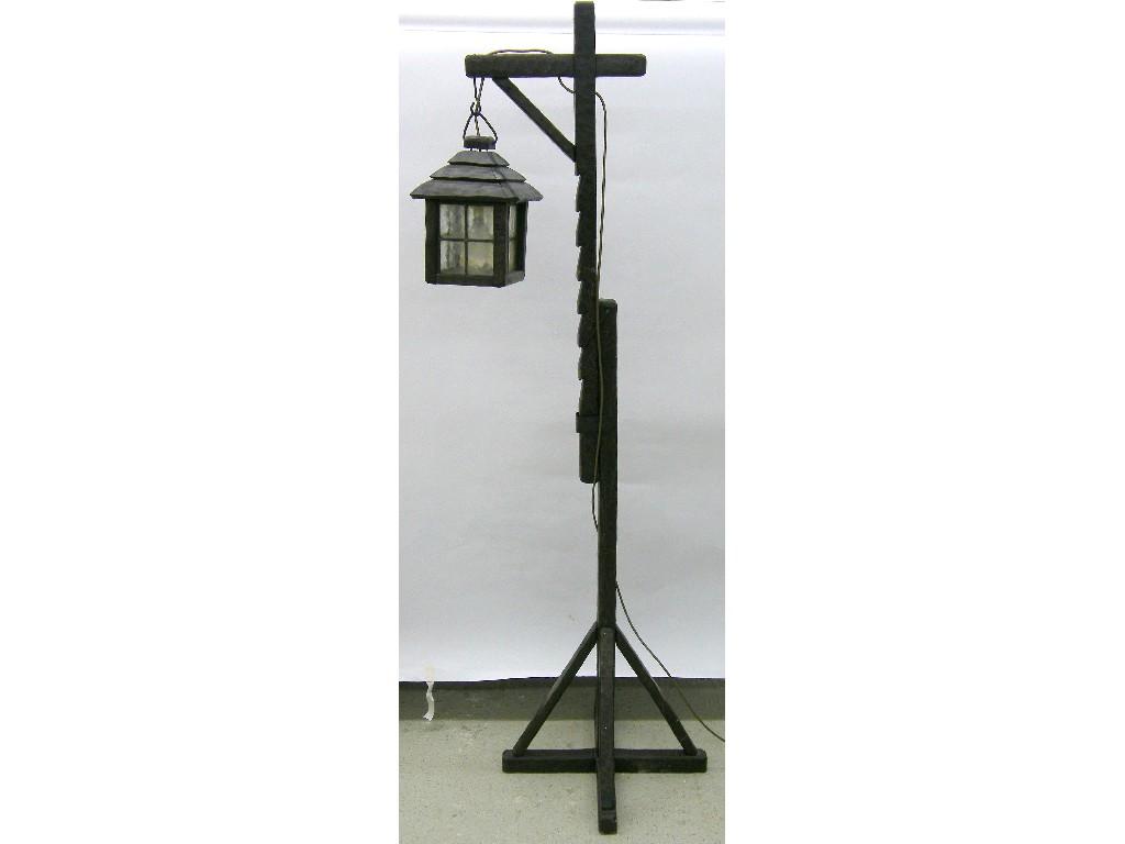 Appraisal: Rustic elm square hanging lantern with leaded glazed panels supported