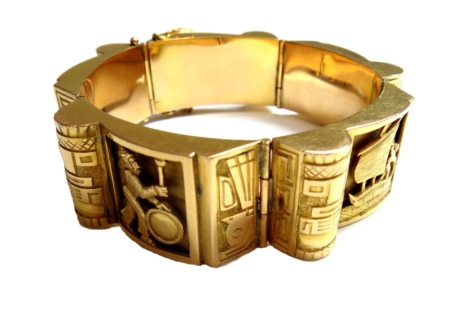 Appraisal: A gold bracelet in a panel shaped link design decorated