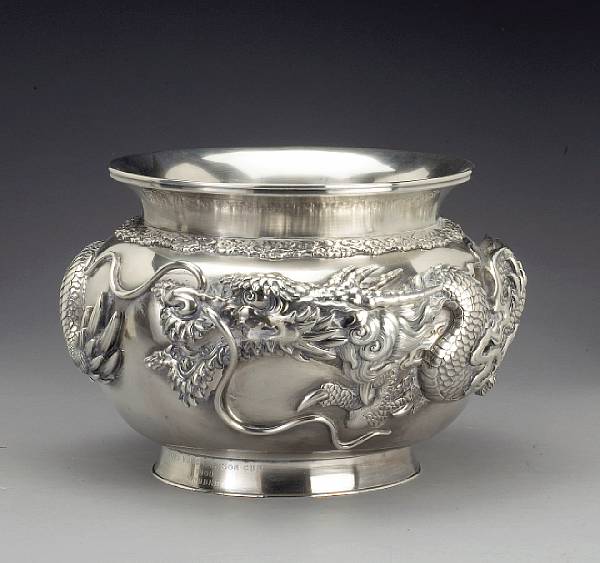 Appraisal: A large repouss decorated silver bowl Meiji Period Of double