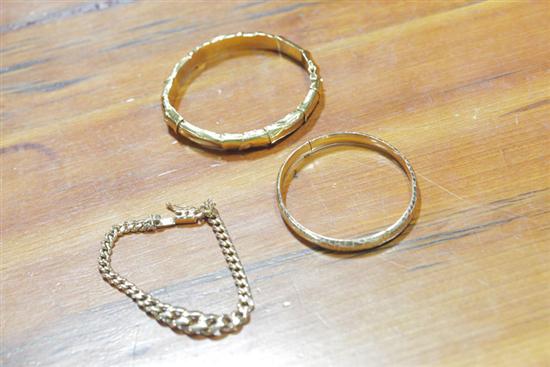 Appraisal: THREE GOLD BRACELETS Two bangles one marked ''K '' the