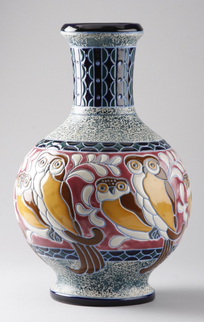 Appraisal: Vases features colorful decoration with owls blue and green border