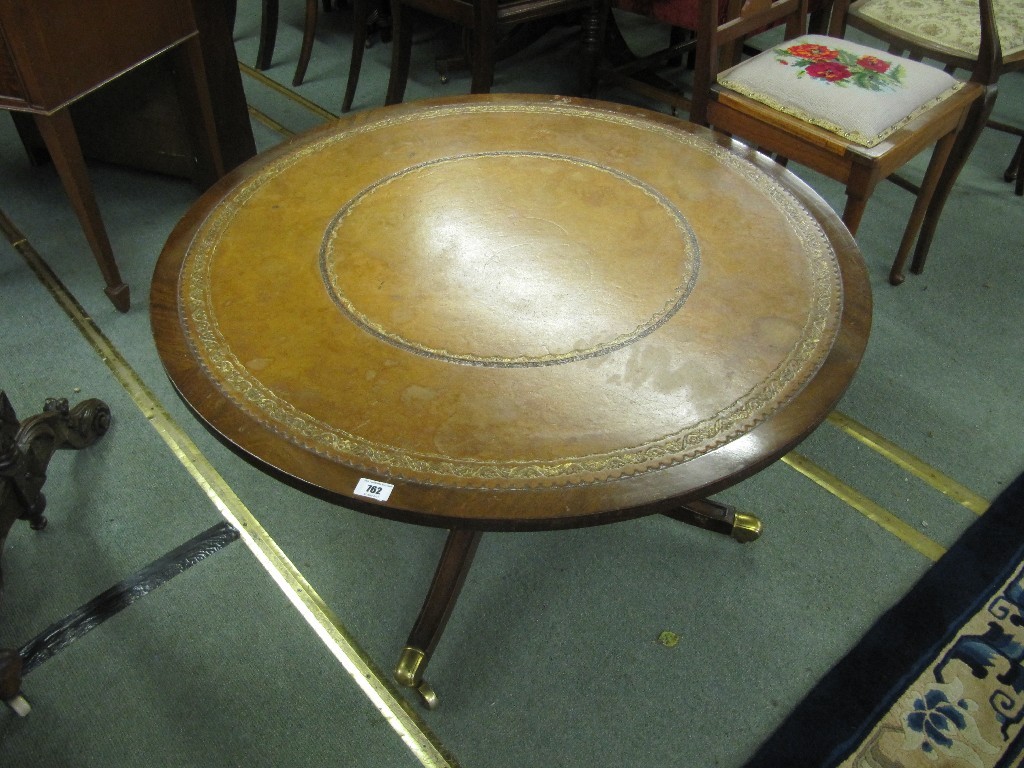 Appraisal: Reproduction mahogany drum shaped coffee table with leather top