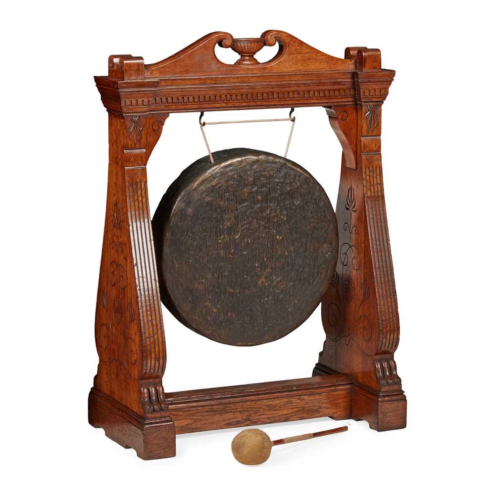 Appraisal: AESTHETIC PERIOD OAK FRAMED DINNER GONG TH CENTURY the hammered