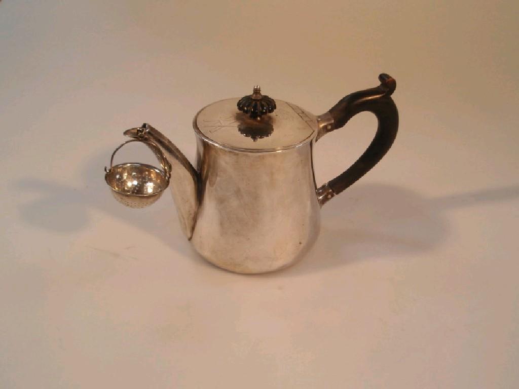 Appraisal: A Victorian silver teapot of a plain waisted design the