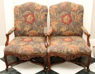 Appraisal: CARVED WALNUT FLORAL UPHOLSTERED OPEN ARM CHAIRS CARVED WALNUT FLORAL