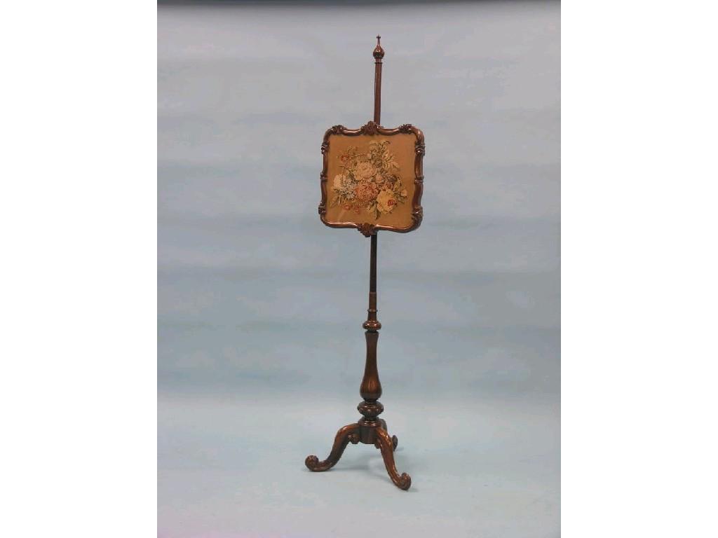 Appraisal: A Victorian rosewood pole-screen with inset glazed tapestry on tripod