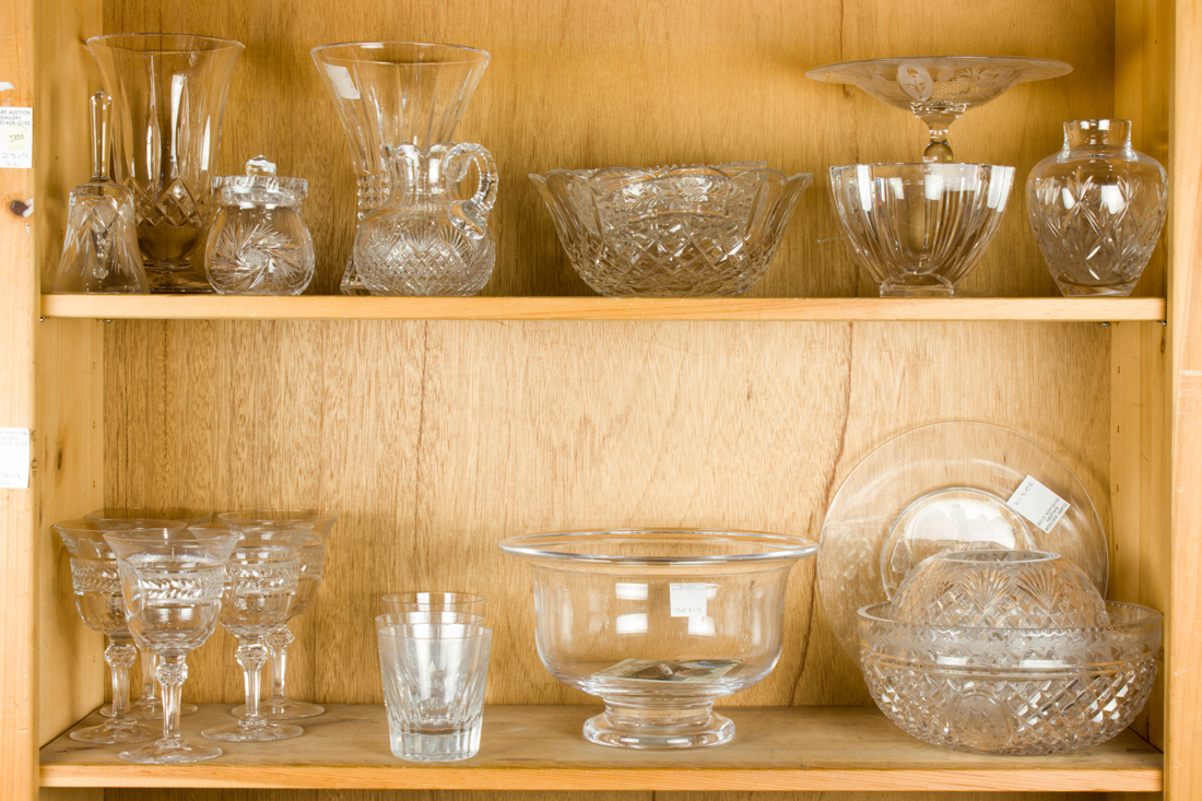 Appraisal: TWO SHELVES OF GLASS TABLE AND STEMWARE Two shelves of