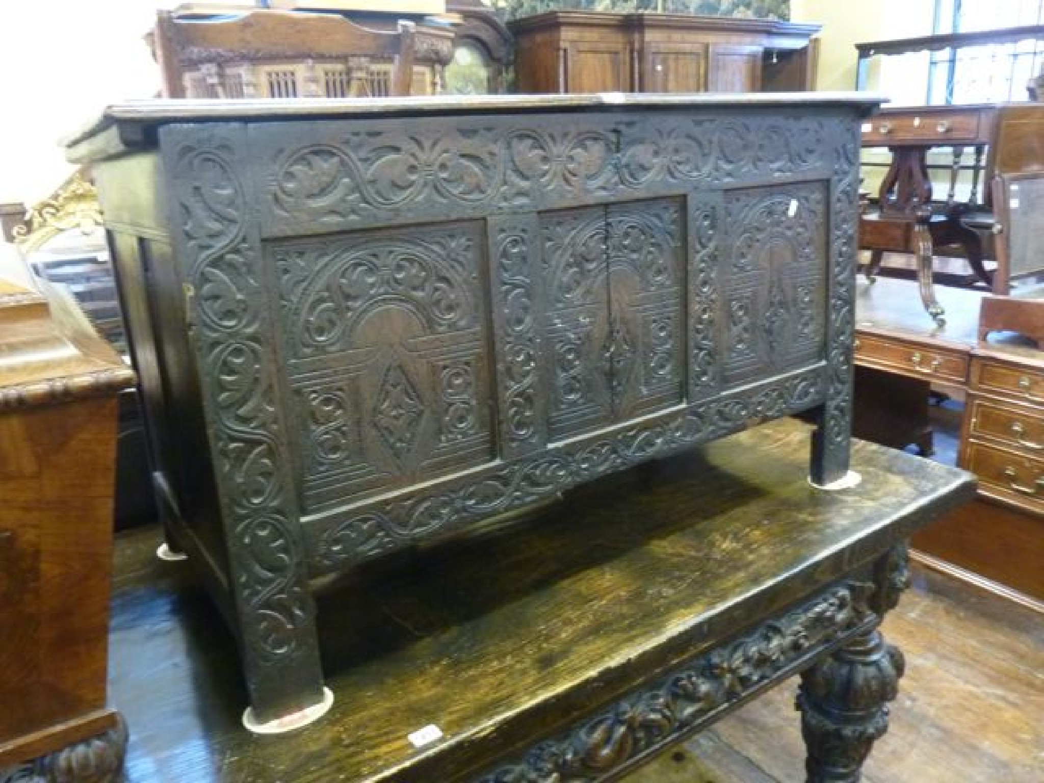 Appraisal: An th century oak coffer with plank top the front