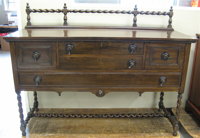 Appraisal: DARK MAHOGANY BUFFET American c 's having a spiral-turned crest