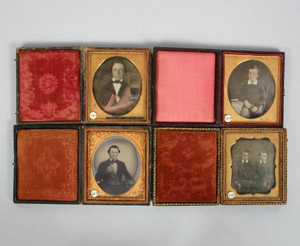 Appraisal: Four leather daguerreotype cases ambro and tintypes images of young