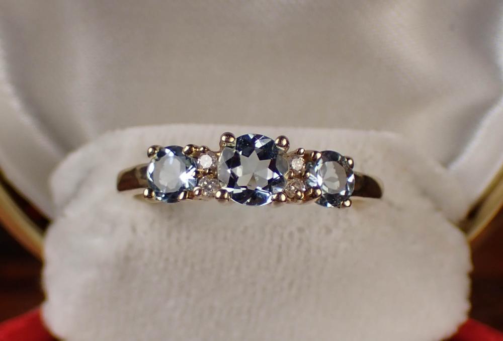 Appraisal: AQUAMARINE DIAMOND AND FOURTEEN KARAT GOLD RING The k yellow