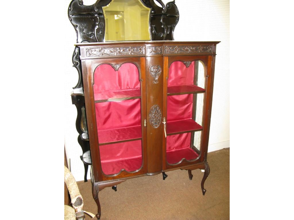 Appraisal: A late Victorian carved mahogany display cabinet frieze carved with