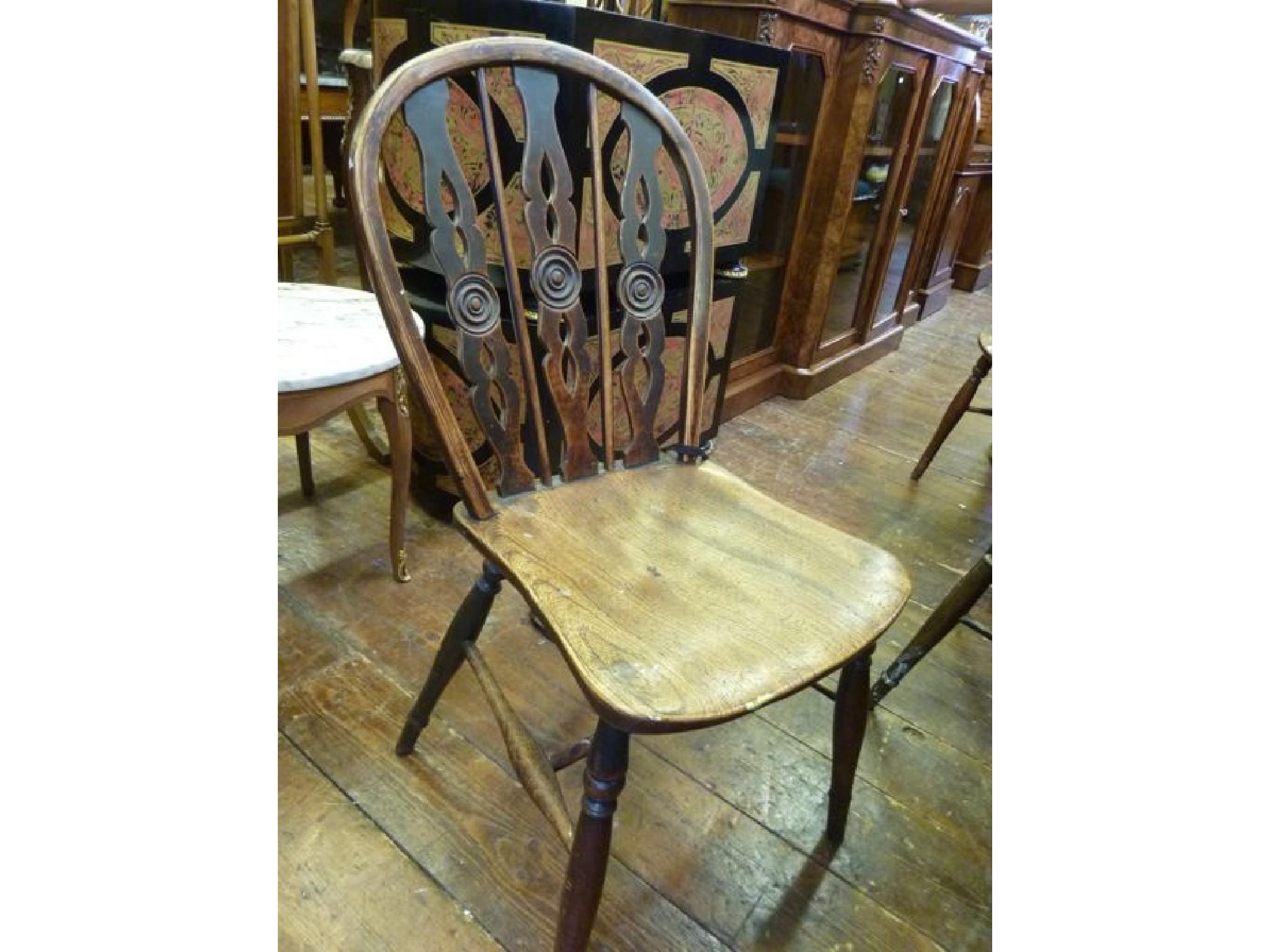 Appraisal: A set of six th century hoop back kitchen chairs