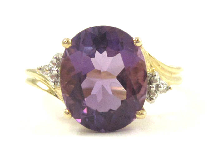 Appraisal: AMETHYST DIAMOND AND TEN KARAT GOLD RING with three round-cut