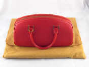 Appraisal: A Louis Vuitton red leather handbag believed unused in protective