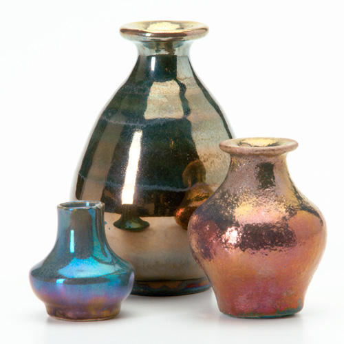 Appraisal: PEWABIC Three late vases each with rich iridescent lusters of