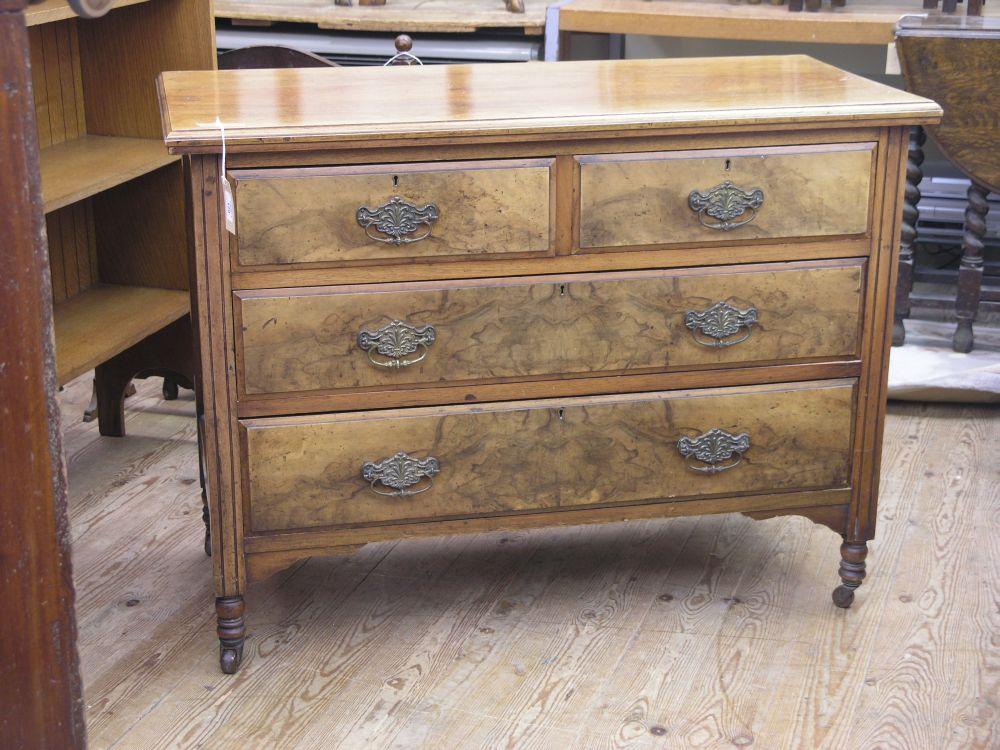 Appraisal: An Edwardian walnut bedroom chest two short and three long