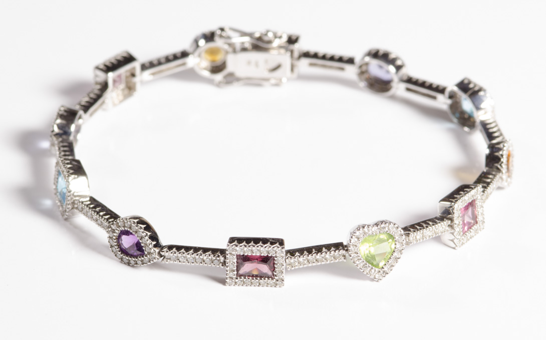 Appraisal: MULTI-COLOR GEMSTONE DIAMOND AND EIGHTEEN KARAT WHITE GOLD BRACELET featuring