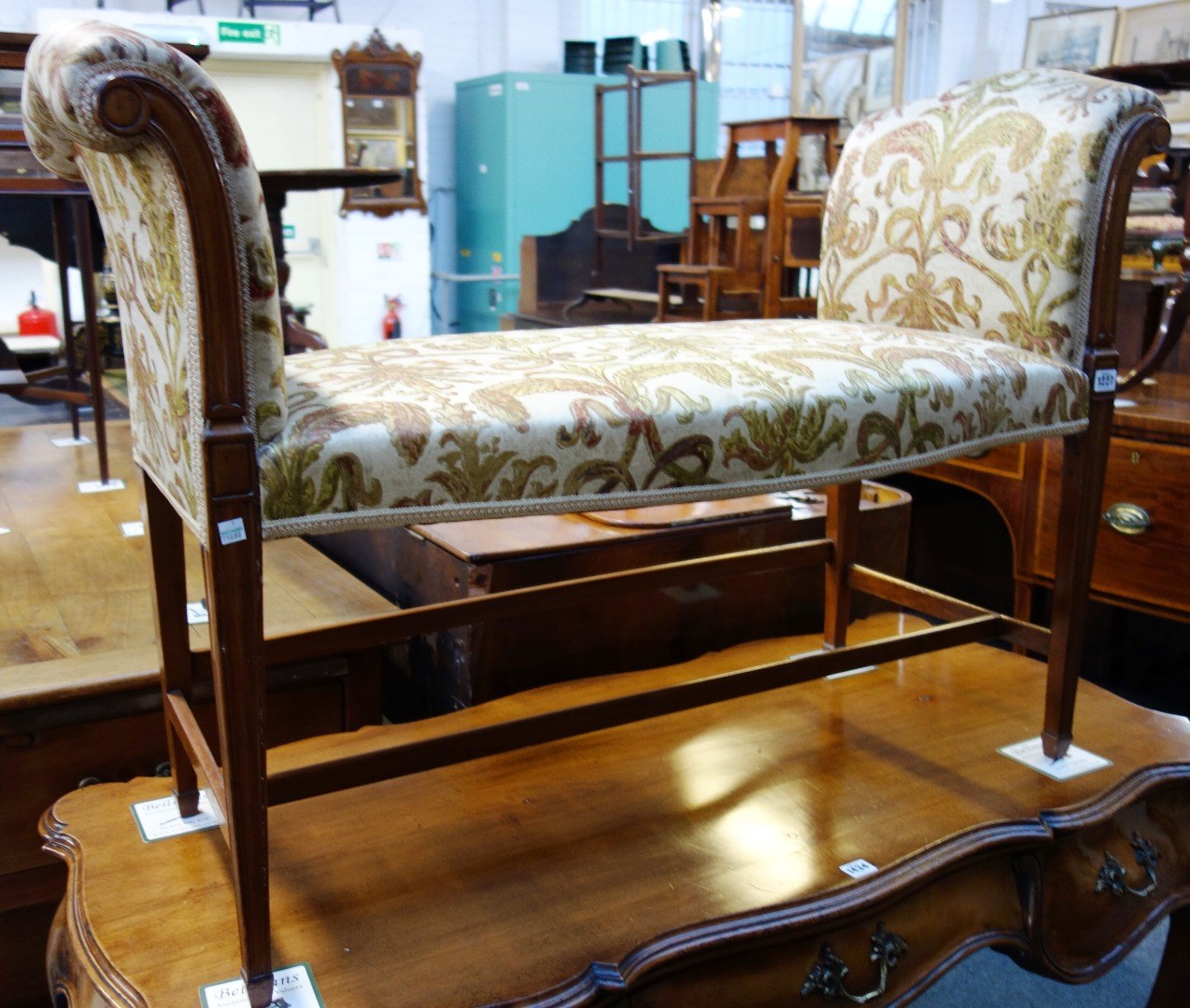 Appraisal: A George III mahogany framed window seat with roll over